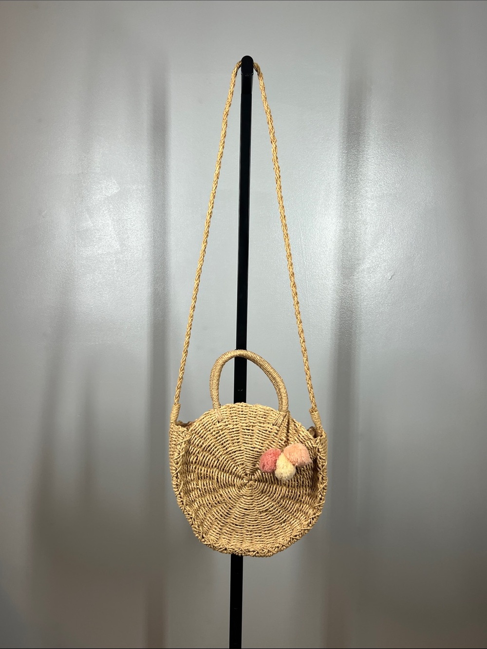 Round Woven Crossbody Bag with Pink & Cream Pom Accents